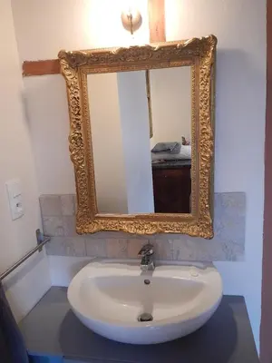 a bathroom with a sink and a mirror at Lagrasse Romantic house, enclosed garden, pool in Lagrasse