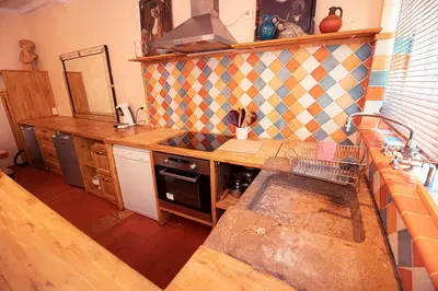 a kitchen with a sink and a counter top at Lagrasse Romantic house, enclosed garden, pool in Lagrasse