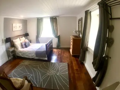 a bedroom with a bed and a window at Maison Tranquil in Bellegarde-du-Razès