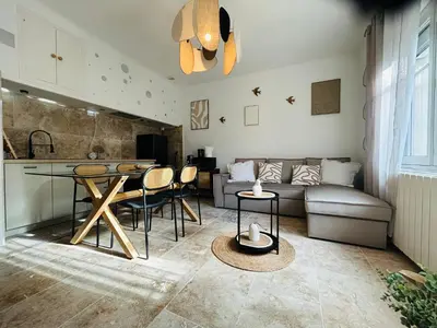 a living room with a couch and a table at Les Dames Carcas in Carcassonne