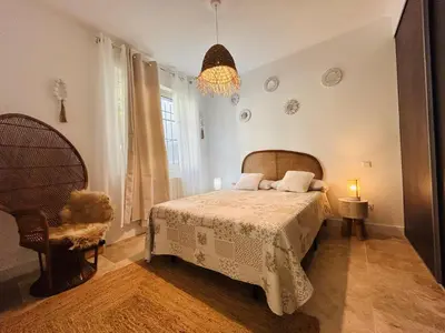a bathroom with a sink and a mirror and a shower at Les Dames Carcas in Carcassonne