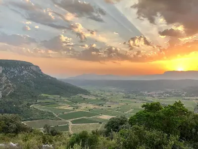 a view of a valley at sunset from a mountain at Villa Kéona , gîte 5 étoiles avec piscine privée et vue nature in Vingrau
