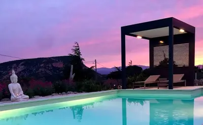 a swimming pool with a pavilion next to aitating at Villa Kéona , gîte 5 étoiles avec piscine privée et vue nature in Vingrau