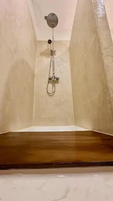a bathroom with a shower with a ceiling at La Casa De Frida charme & poésie in Narbonne