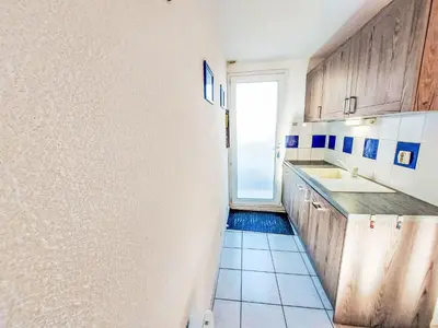 a small kitchen with a sink and a window at Holiday Home Bora Bora 2-3 by Interhome in Gruissan