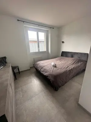 a bedroom with a bed and a window at House with garden near Castres city center in Castres