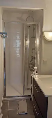 a bathroom with a shower and a sink at Maison de village in Sigean