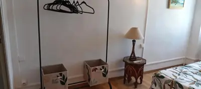a bedroom with two boxes next to a bed at Maison de village in Sigean