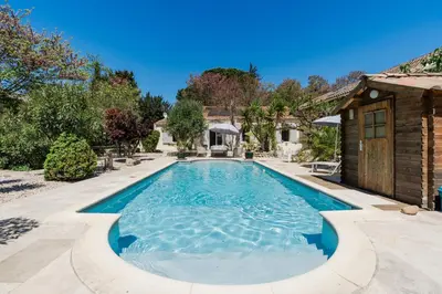 a swimming pool in the backyard of a house at La Villa Narbo Martius in Ornaisons