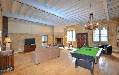 a large living room with a pool table in it at Apaisante Maison Authentique in Sainte-Foi