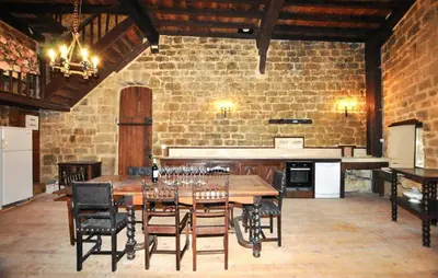 a dining room with a table and some chairs at Apaisante Maison Authentique in Sainte-Foi