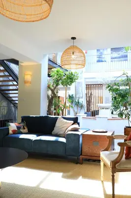 a living room with a blue couch and a table at Le Pavillon - Demeure de prestige avec14 chambres pour 30 pers - Piscine in Garrevaques