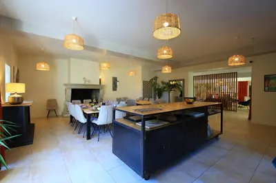 a dining room with a table and chairs and lights at Le Pavillon - Demeure de prestige avec14 chambres pour 30 pers - Piscine in Garrevaques