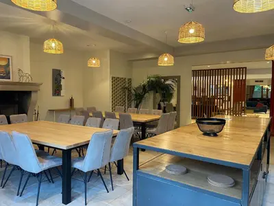a dining room with tables and chairs and lights at Le Pavillon - Demeure de prestige avec14 chambres pour 30 pers - Piscine in Garrevaques