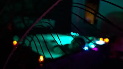 a blurry picture of some lights in the dark at Love Room CHARME et PLAISIRS in Mazamet