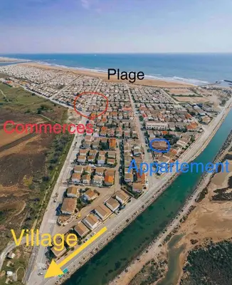 an aerial view of a resort with a map of the place at Duplex plage des chalets Gruissan plage in Gruissan