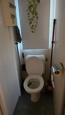 a small bathroom with a white toilet in a room at ZEN Mobil Home Occitanie 6P Tout confort & Climatisation in Port-la-Nouvelle