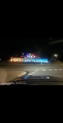 a view of a street at night with neon lights at ZEN Mobil Home Occitanie 6P Tout confort & Climatisation in Port-la-Nouvelle