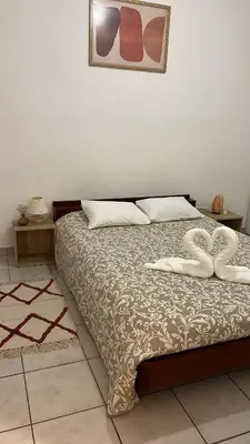 a bedroom with a bed with two hearts on it at Charming apartment with terrace and parking in Carcassonne in Carcassonne