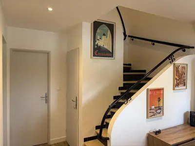 a staircase in a home with a stair case at La Parenthèse Carcassonnaise in Carcassonne