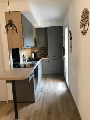 a kitchen with a wooden counter top in a room at Maison d'hôtes à Castres-Saïx in Saix