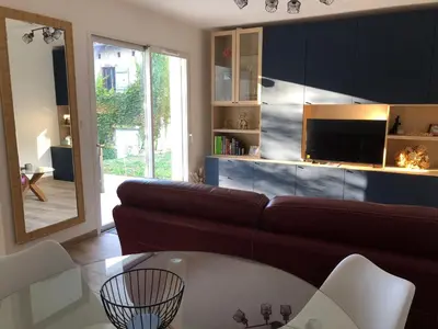 a living room with a couch and a table at Maison d'hôtes à Castres-Saïx in Saix