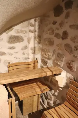 two glasses of pink champagne sitting on a bar at Loveroom, La Tour Secrete Jacuzzi, Sauna, plage, Clim, Netflix, Wifi Aude, occitanie in Vinassan