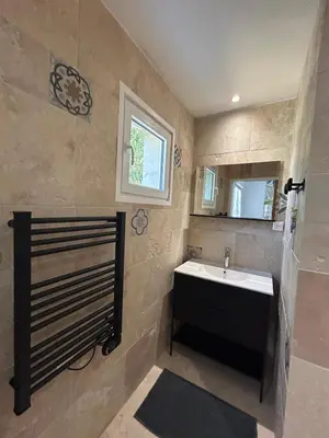 a bathroom with a sink and a mirror at Gîte de la Trémiére in Salles-d'Aude