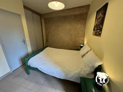 a bedroom with a bed and a dresser and a bed at La marelle in Villerouge-Termenès