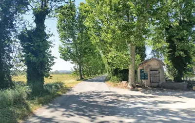 a road with a small building on the side at Nice Home In Narbonne With Sauna in Narbonne