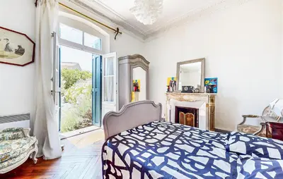 a bedroom with a bed and a fireplace at Awesome Home In Capendu in Capendu