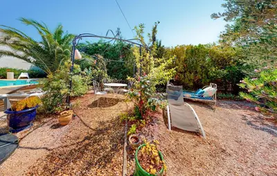 a garden with a swing and a table and chairs at Awesome Home In Capendu in Capendu