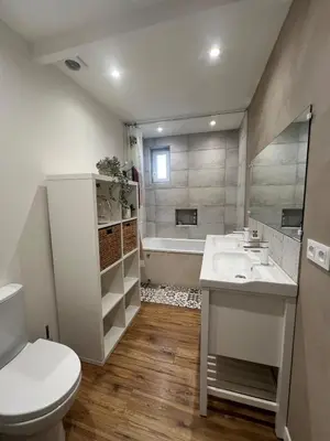 a bathroom with a toilet and a sink and a tub at Charmante ferme familiale in Guitalens