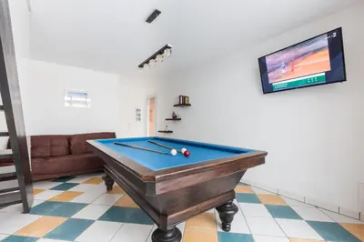 a pool table in a living room with a tv at Opuntia Teouliero location en Méditerranée in Escales