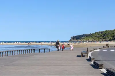 a group of people walking on a pier at the beach at Opuntia Teouliero location en Méditerranée in Escales