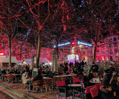 a group of people sitting at tables at a christmas event at Escale au pied de la cité in Carcassonne