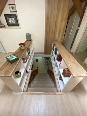 a room with a staircase in a house at Chambres d'hôtes -L'Atelier du Presbytère