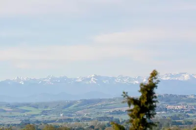 a view of a valley with mountains in the distance at Le domaine de rigou in Lasbordes