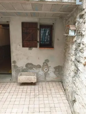 a building with a bench in front of a window at Maison Au Phil de Lau in Raissac-dʼAude