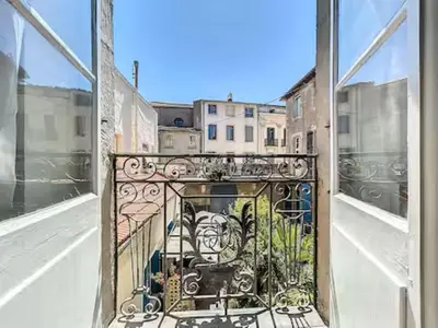 a window with a view of a city at Charmant T2 Narbonne centre in Narbonne