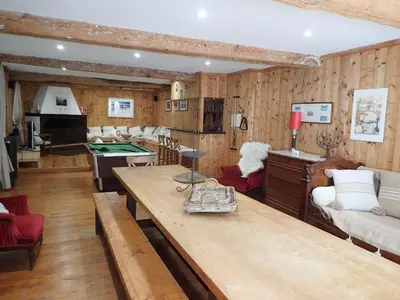 a living room with a table and a pool table at Beautiful 17th century character residence in Fontiers-Cabardès