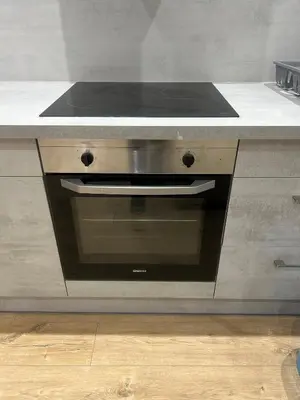 a stove top oven sitting in a kitchen at Les berges de la cité in Carcassonne