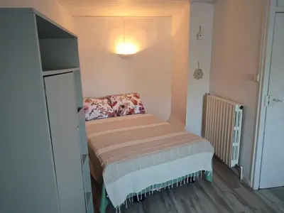a small bedroom with a small bed in a room at Chez Christine et Fred in Villedaigne