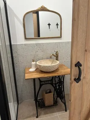 a bathroom with a sink and a mirror at La Table du Chevalier - Cité in Carcassonne