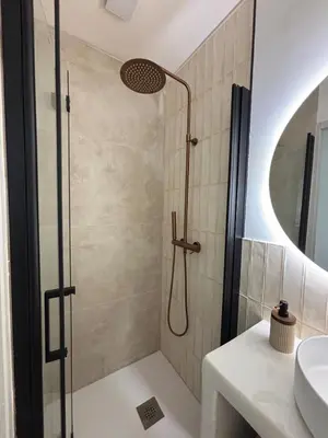 a bathroom with a shower and a sink at Le Petit Faubourg - Cocooning and bright - Cité in Carcassonne