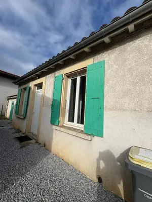 a kitchen with white cabinets and a washer and dryer at Maison indépendante l Climatisation l Extérieur in Castres