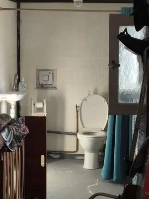 a bathroom with a toilet and a sink at maison chalet in Bessède-de-Sault