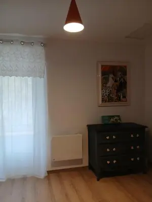 a living room with a dresser and a window at La route des vignes in Val-de-Dagne