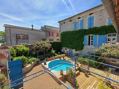a view of a garden with a slide at SAINT-JULIA - Studio in Saint-Julia