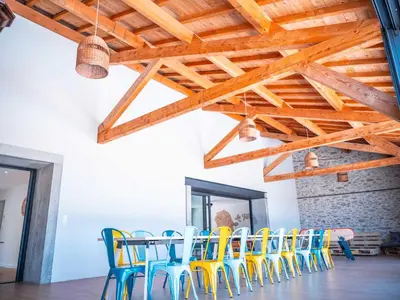 a dining room with a table and chairs at La Borie Lautrecoise - 26 pers - Piscine chauffée & Clim in Jonquières